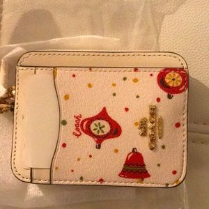 Coach zip around Christmas ornament detail credit card and holder w chain.